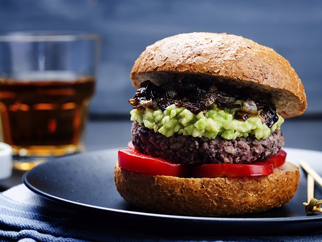 Black bean and sweet potato burgers with avocado mash