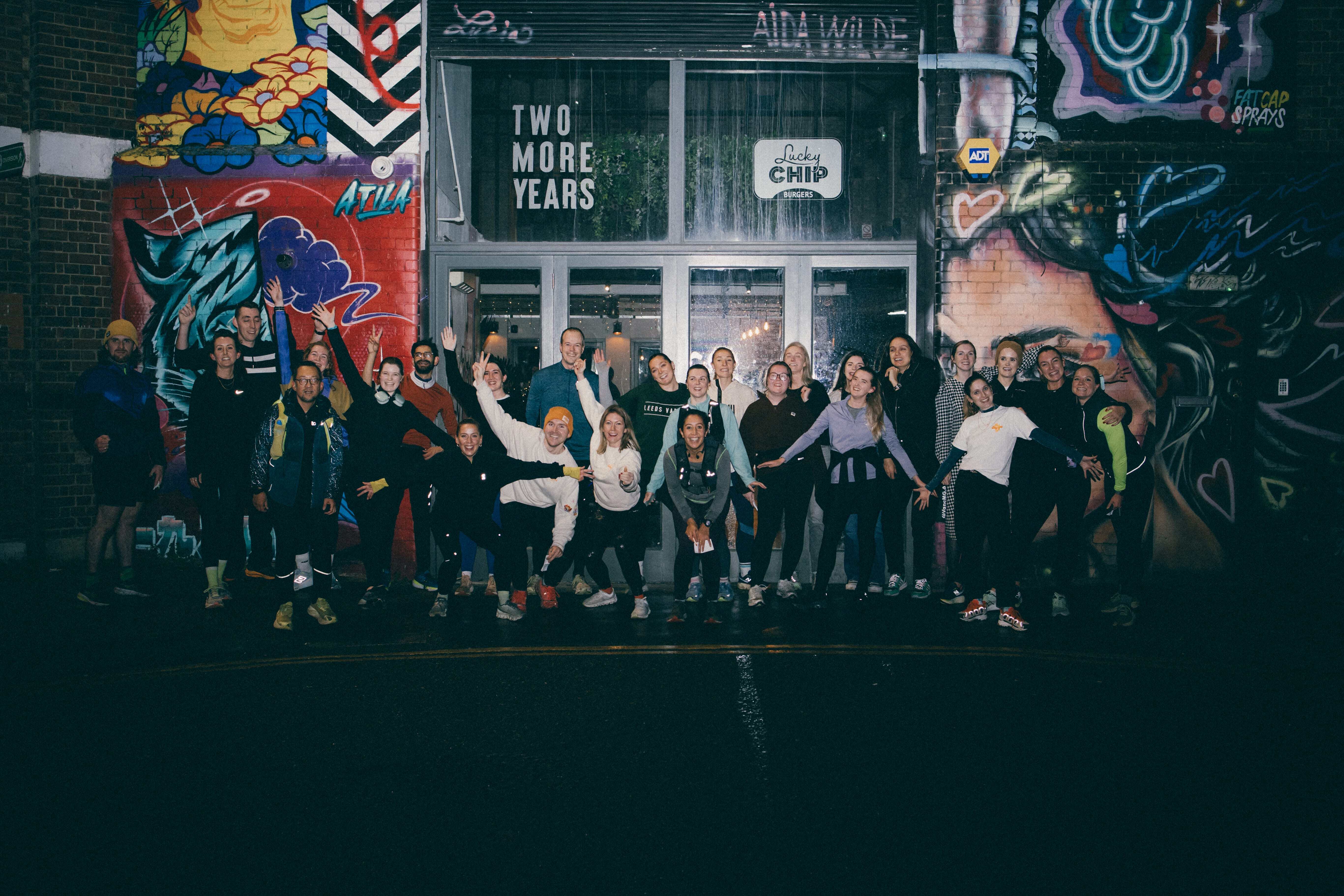 realbuzz team pictured in the dark, in winter running gear.