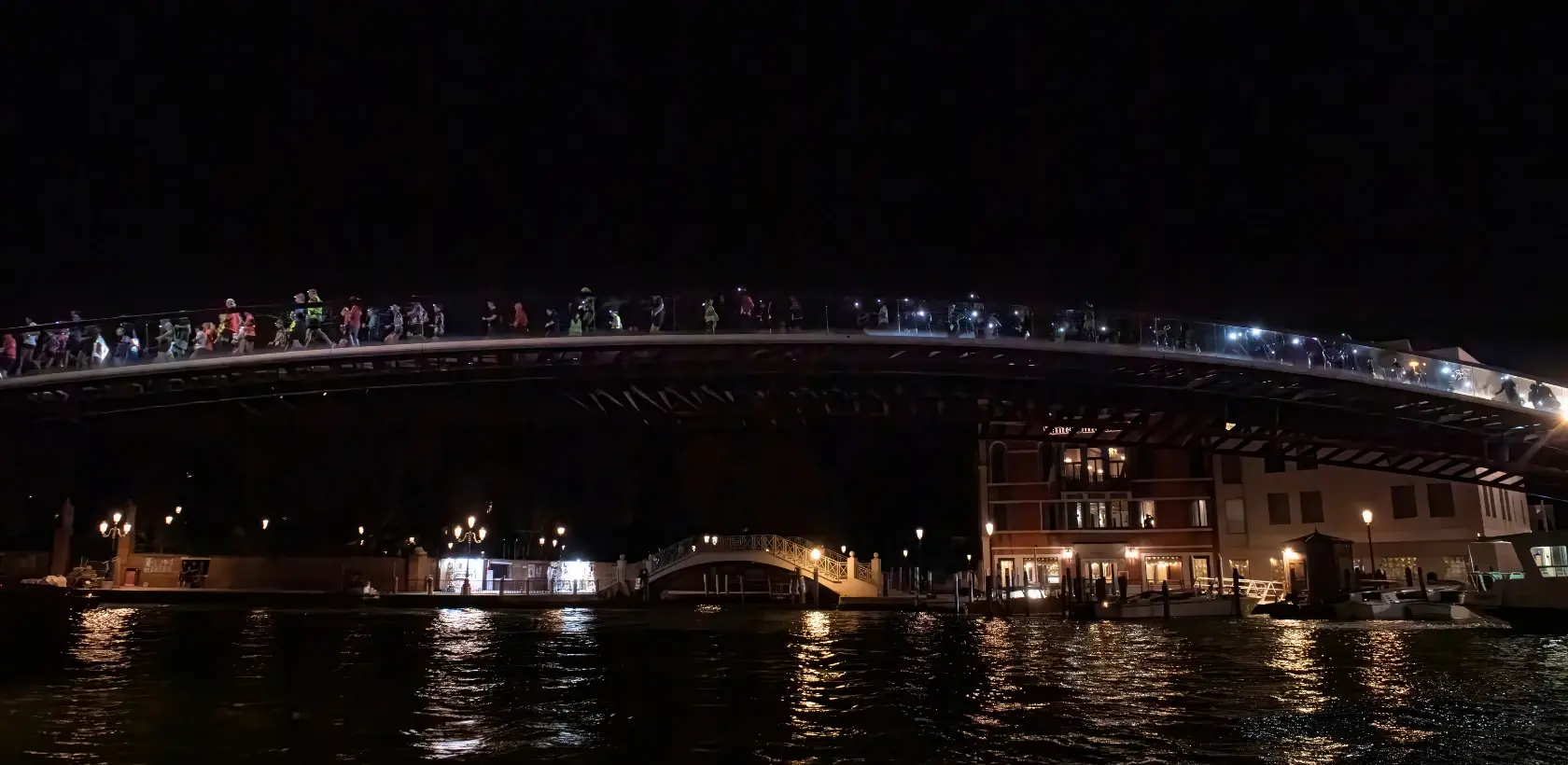 Venice night trail runners over bridge