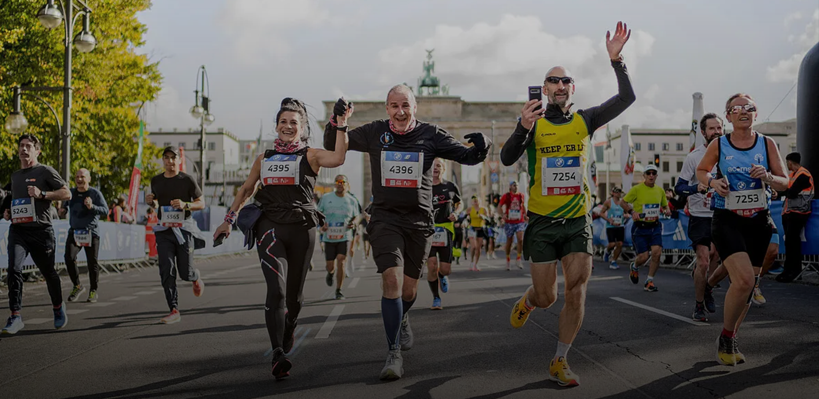 Runners at the Berlin BMW Marathon, with Brandenburg Gate in the background.